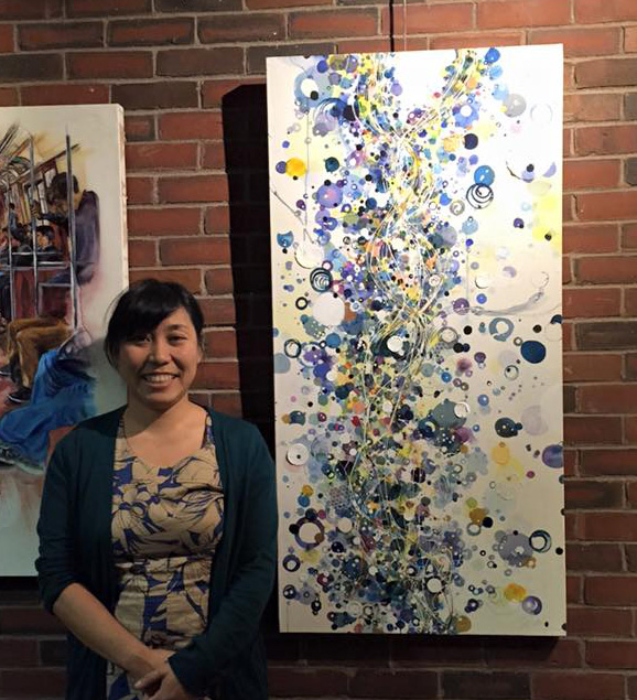 Chie showing her art at a gallery in Boston, MA.